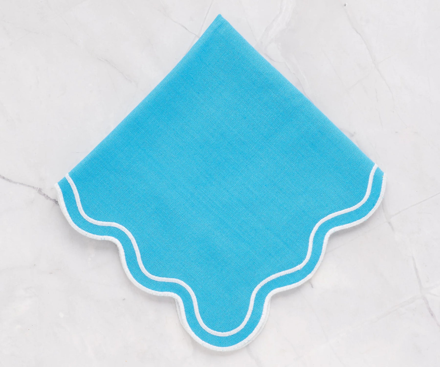 Turquoise scalloped napkins paired with a matching scalloped tablecloth, elegant 100% cotton napkins for weddings, parties, and everyday meals
