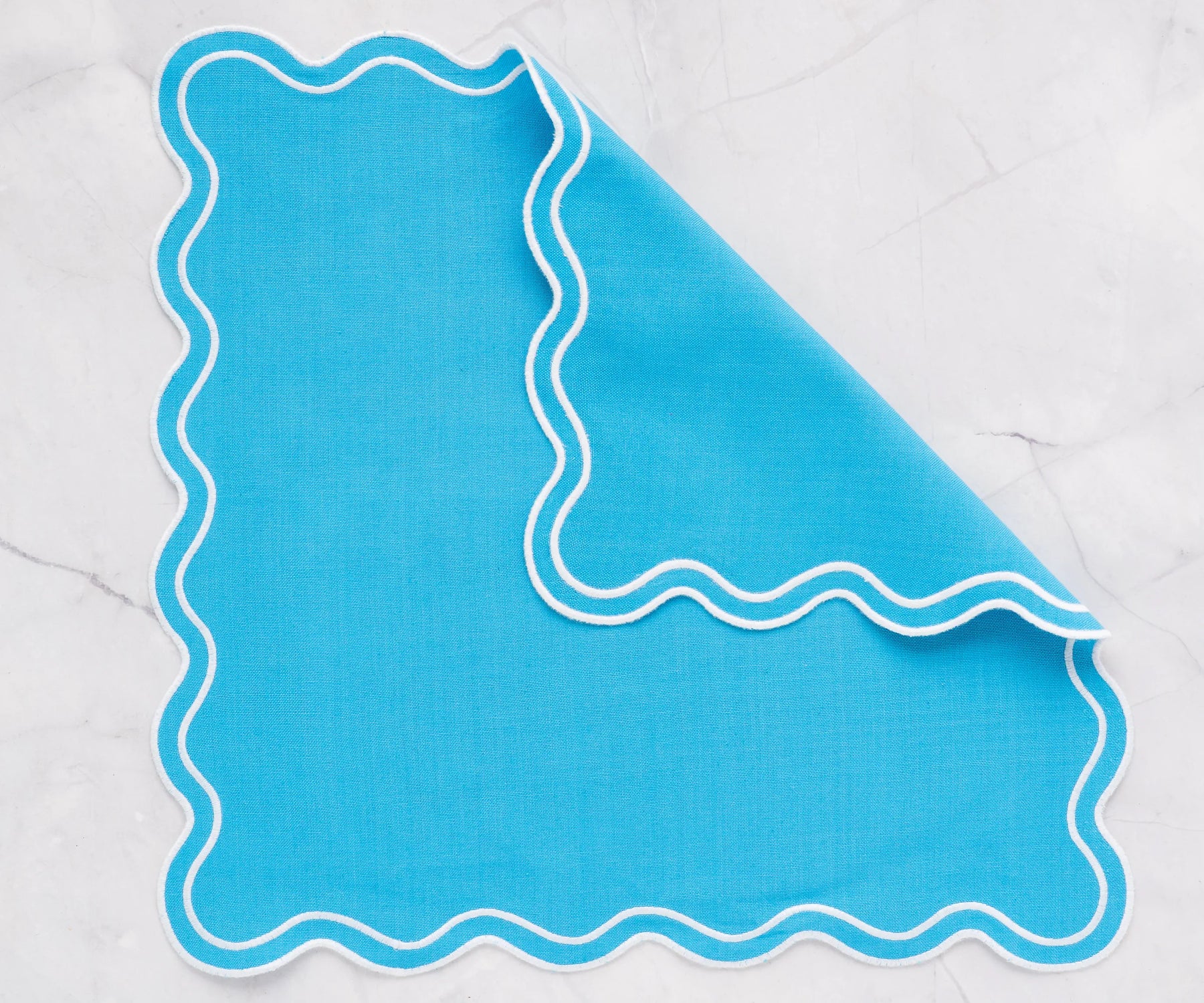 Turquoise scalloped edge napkins in 100% cotton, available in 18x18, 20x20, and 22x22 inch sizes, perfect for family dining and events