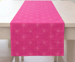 Bright pink table runner with subtle small motifs