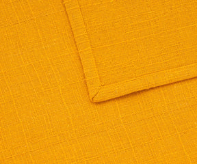 Close-up of yellow cotton napkins showing soft, absorbent texture.