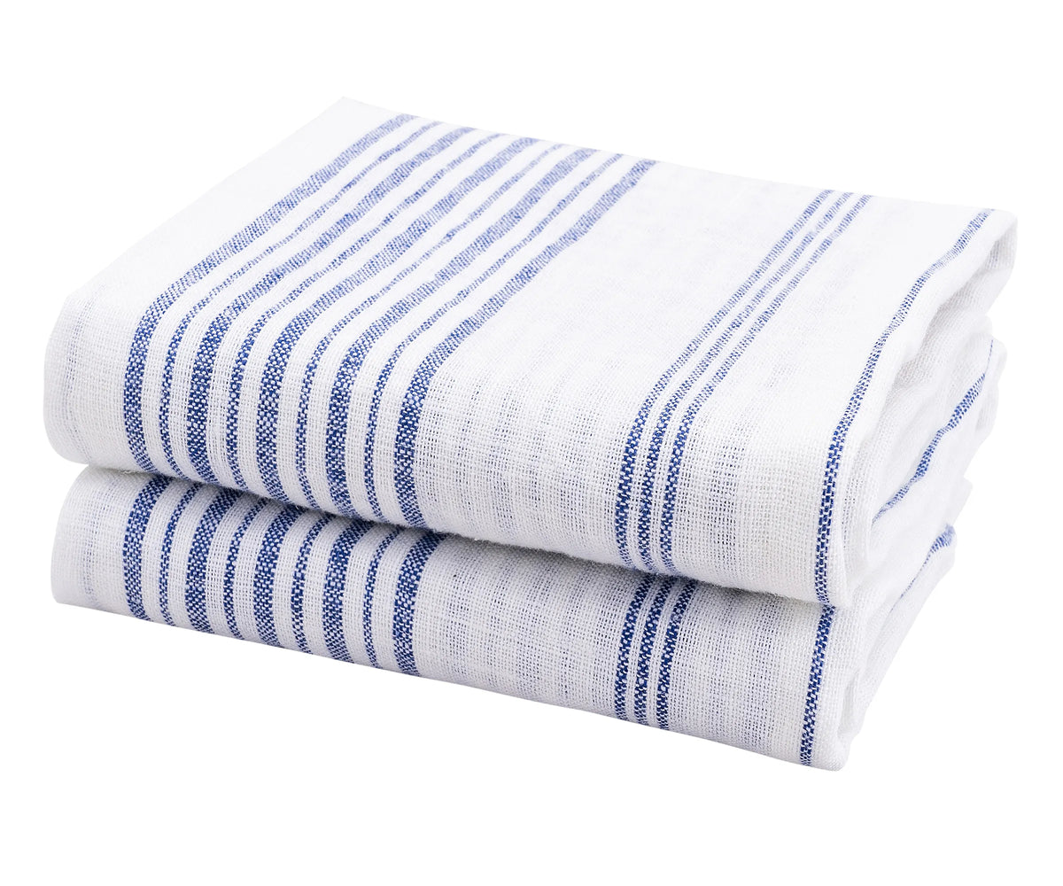 Set of 2 blue linen tea towels hanging in a modern kitchen