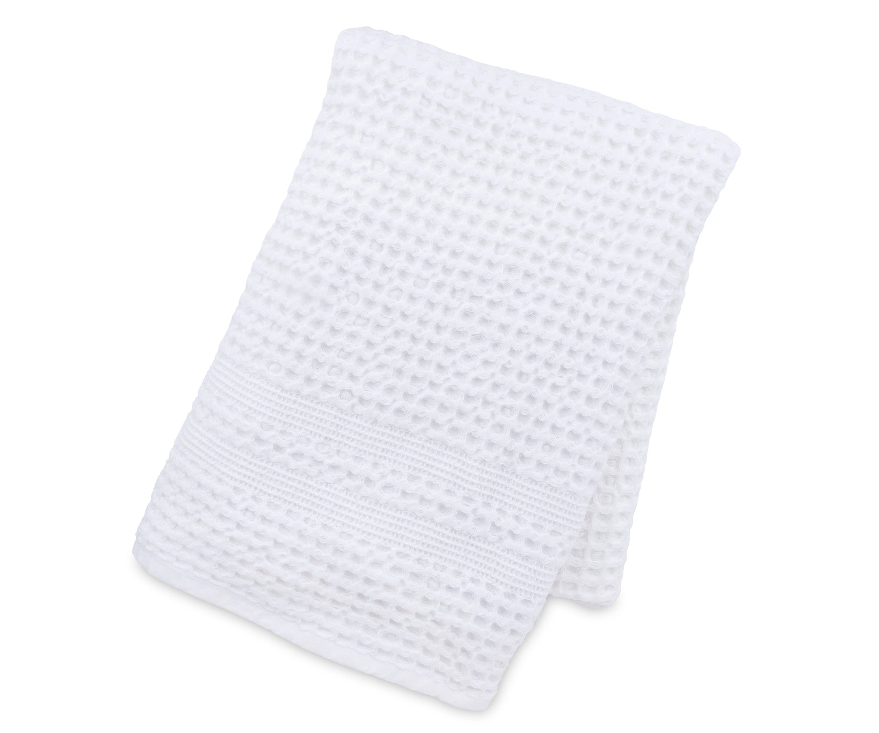 Soft waffle weave blanket draped over a couch for a modern home décor touch.
