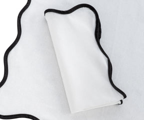 black cotton napkins with scalloped edges, stylish and reusable.