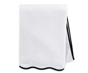 Good quality cotton bath towel in white with black border, featuring plush texture, quick-dry performance, and a modern minimalist design for daily luxury.