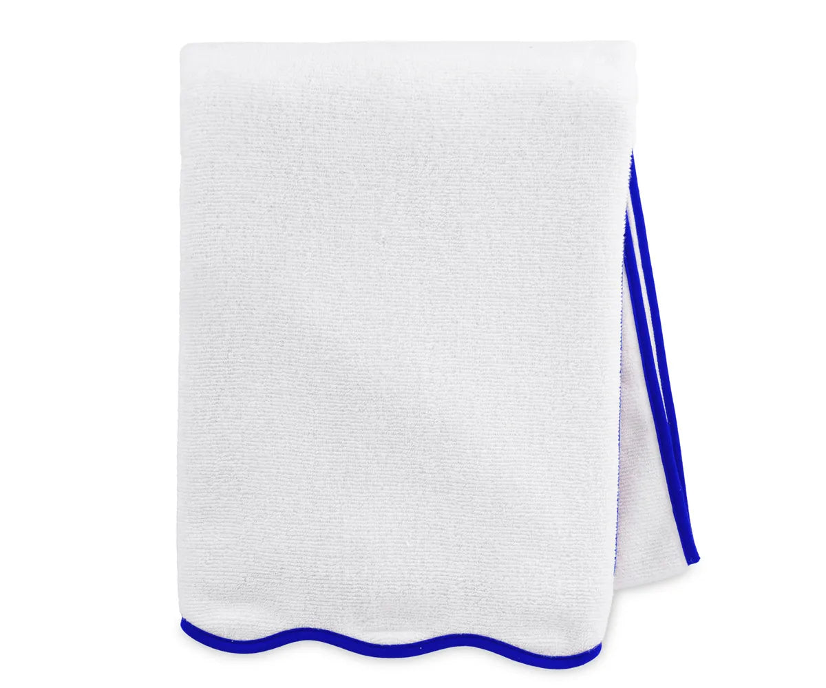 Close-up of royal blue and white bath towel highlighting plush cotton weave and absorbency