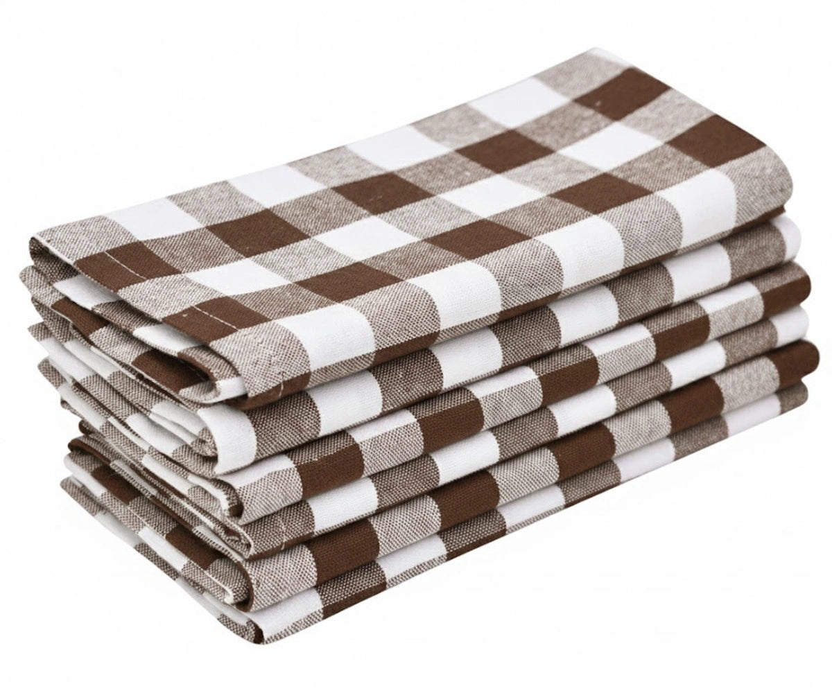 Stack of black buffalo checkered cloth napkins in brown and white plaid pattern