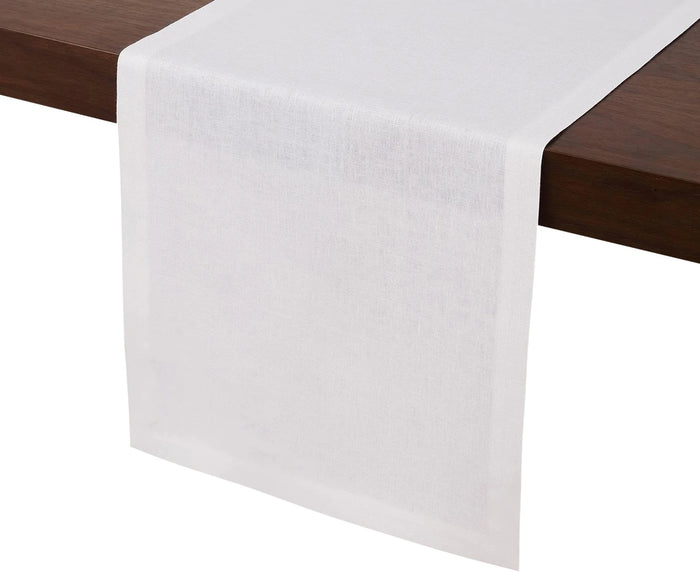 White linen table runner 14x72 inches with hemmed edges on wooden dining table