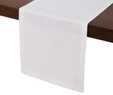 White linen table runner 14x72 inches with hemmed edges on wooden dining table