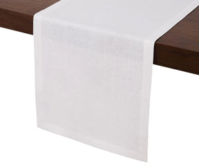 White linen table runner 14x72 inches with hemmed edges on wooden dining table