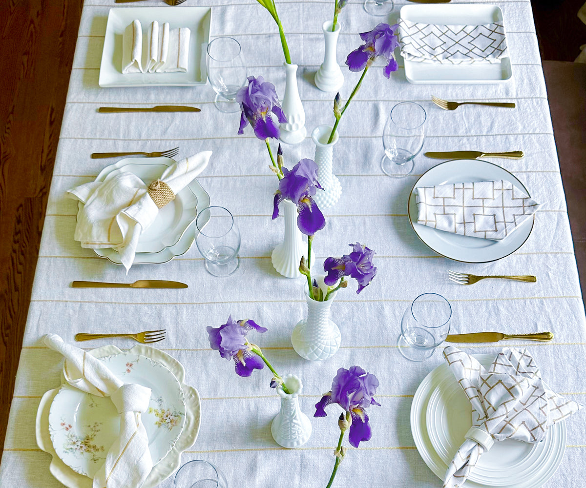 Spring elegance blooms as your table is adorned with a gold rectangular tablecloth, infusing vibrancy into every gathering.