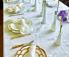 Add a touch of spring elegance to your event with a gold rectangular tablecloth, perfectly enhancing your table setting.