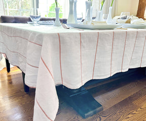 Elevate various settings using copper, wedding, and farmhouse tablecloths, each uniquely contributing to the desired atmosphere.