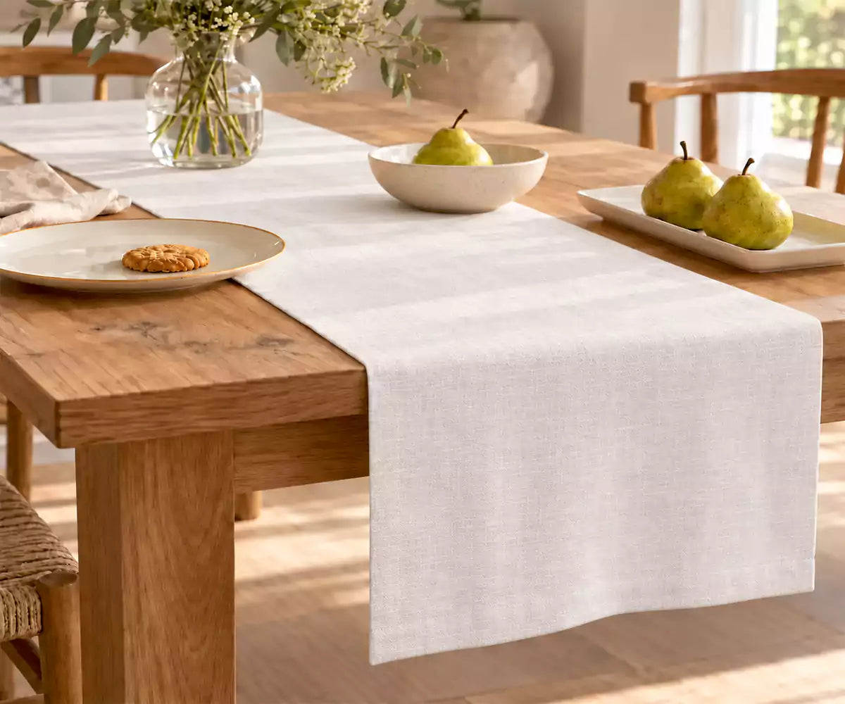 White 100% linen table runner with a clean solid design for elegant dining table settings