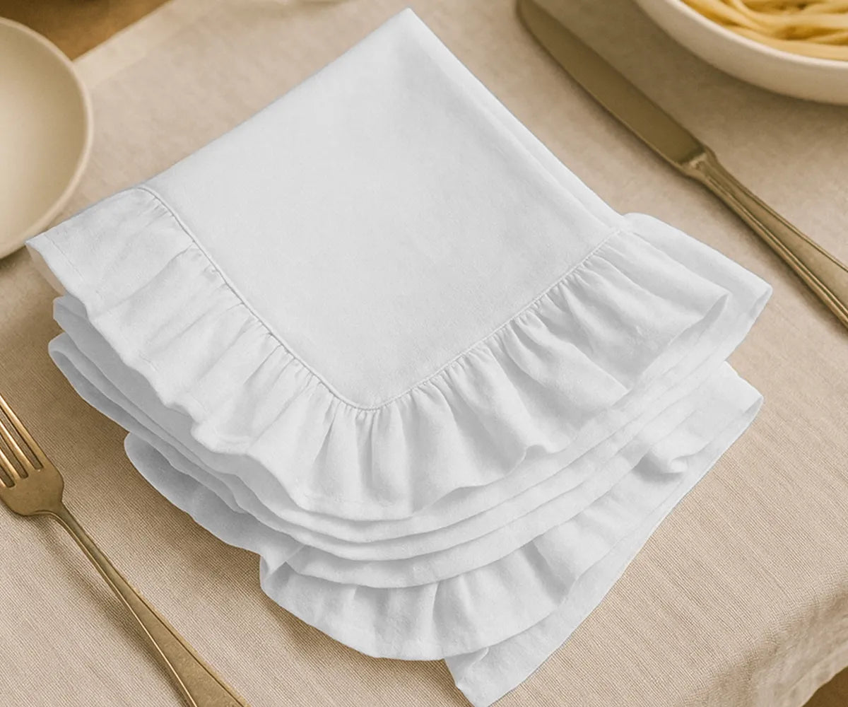 White cotton ruffle edge dinner napkins, reusable and absorbent cloth napkins for weddings, parties, holidays, and everyday family dining table décor.