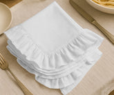 White cotton ruffle edge dinner napkins, reusable and absorbent cloth napkins for weddings, parties, holidays, and everyday family dining table décor.