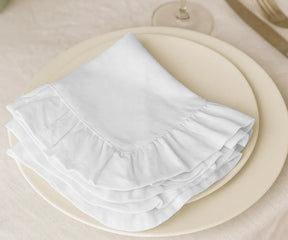 Set of 100% cotton white ruffled napkins, eco-friendly and washable fabric dinner napkins available in bulk or small sets, perfect for rustic farmhouse, modern, or elegant table settings.