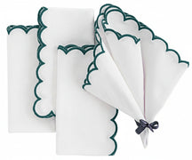 Deep green and white napkin neatly folded on table setup, durable cloth napkin