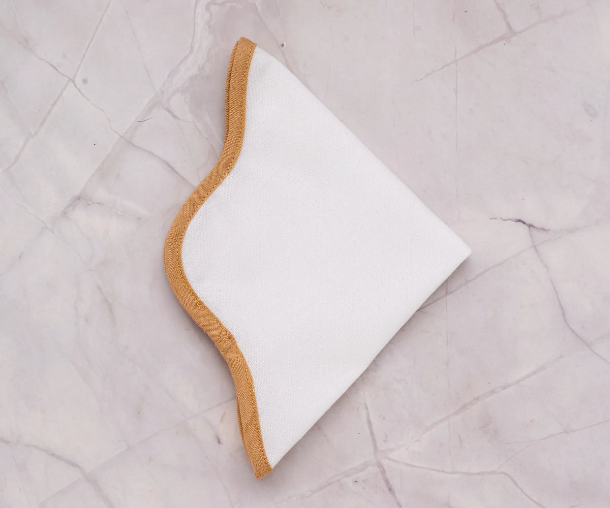 Soft 100% cotton tablemat in white with fine stitching, reusable and machine washable for family dinners and special occasions
