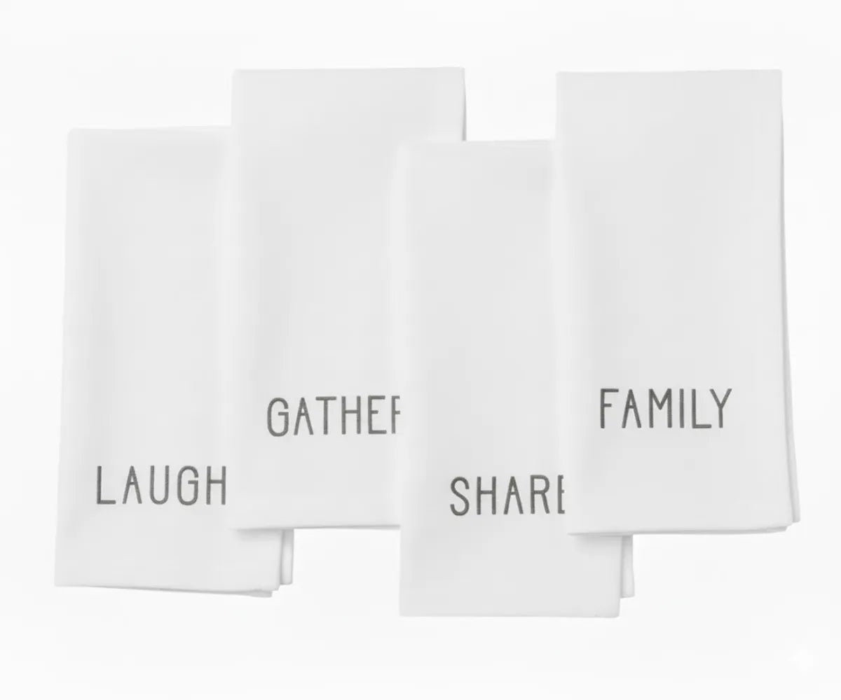 White embroidered cotton napkin with subtle white stitching — classic minimalist dinner napkin for elegant table decor.