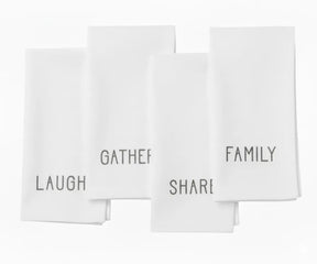 White embroidered cotton napkin with subtle white stitching — classic minimalist dinner napkin for elegant table decor.