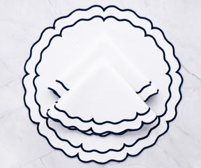 Durable woven cotton placemats featuring navy and white accents