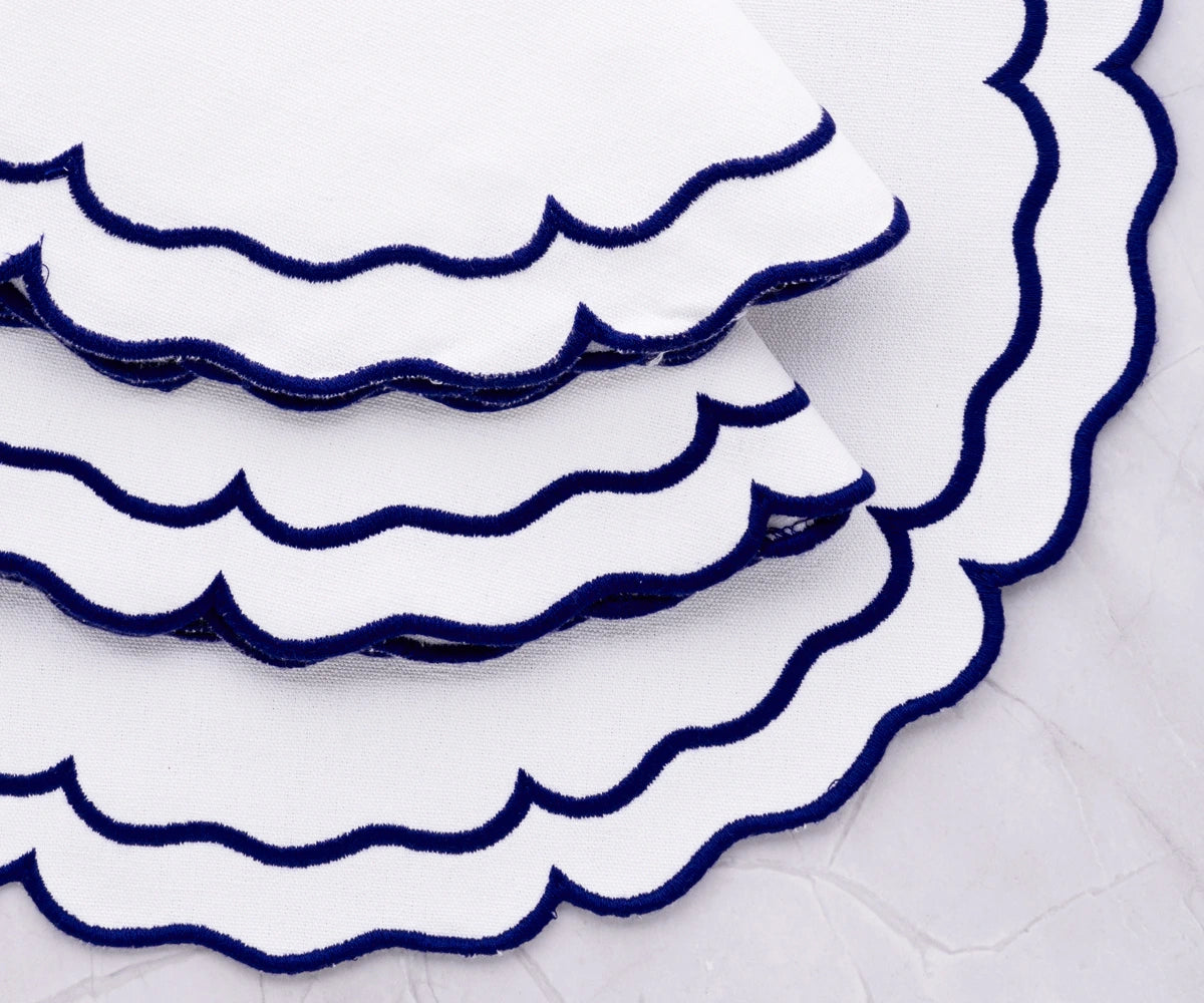 Durable woven cotton placemats featuring royal blue edges
