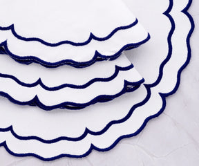 Durable woven cotton placemats featuring royal blue edges