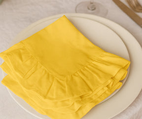 Yellow cotton ruffle edge dinner napkins, reusable and absorbent cloth napkins for weddings, parties, holidays, and everyday family dining table décor.