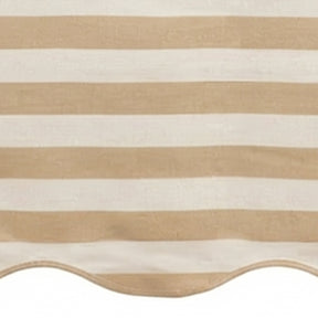 Beige and white cabana striped table runner with a scalloped edge detail.