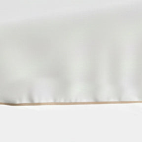 Set of white cotton placemats with beige trim