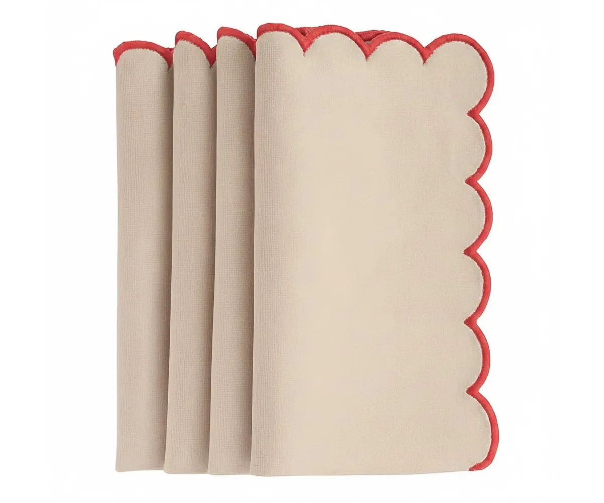 Decorative scalloped dinner napkins with red trim border