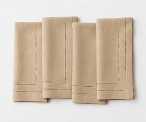 Soft beige linen table napkins with premium double hemstitch, perfect for farmhouse dining, bridal showers, holiday meals, and everyday use.