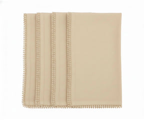 Beige cotton pom pom napkins with knotted edge for neutral farmhouse table décor