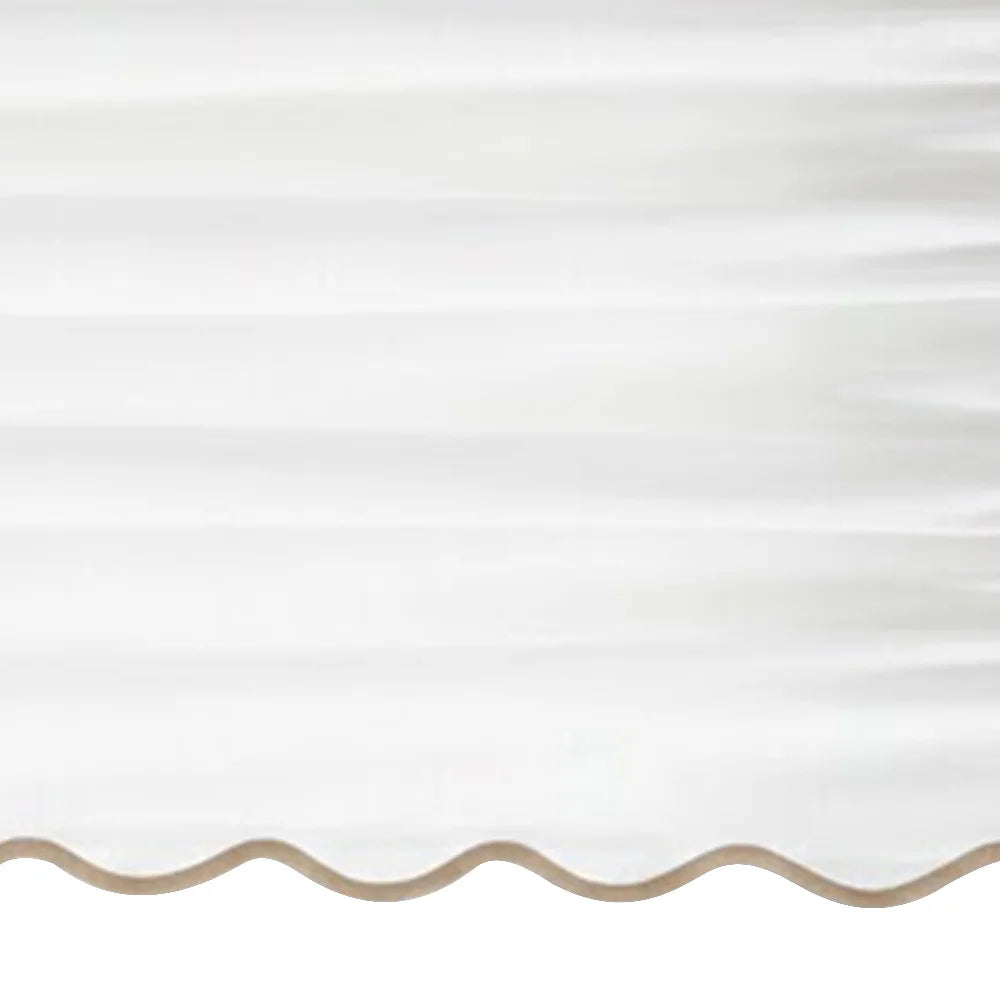 White scalloped curtain panel with beige trim - Close up