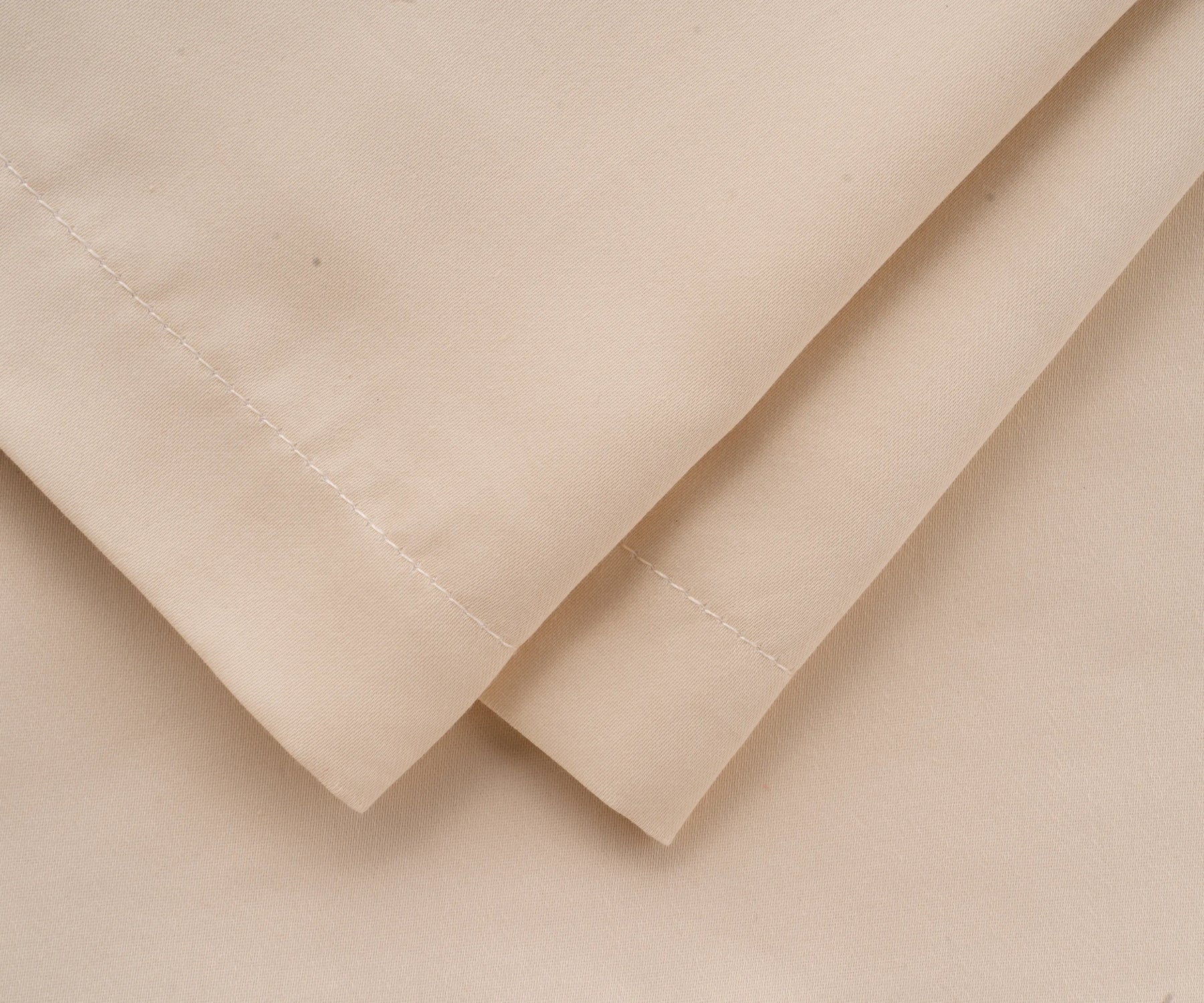 Luxury beige cotton pillow cases with silky sheen, available in standard, queen, and king sizes