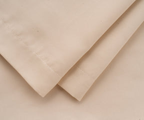 Luxury beige cotton pillow cases with silky sheen, available in standard, queen, and king sizes