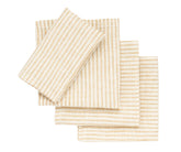 Natural-toned linen napkins rolled with twine for rustic wedding table décor