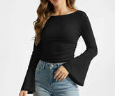 Women’s black long sleeve organic cotton boatneck t-shirt laid flat, showing soft breathable fabric and modern minimalist fit.