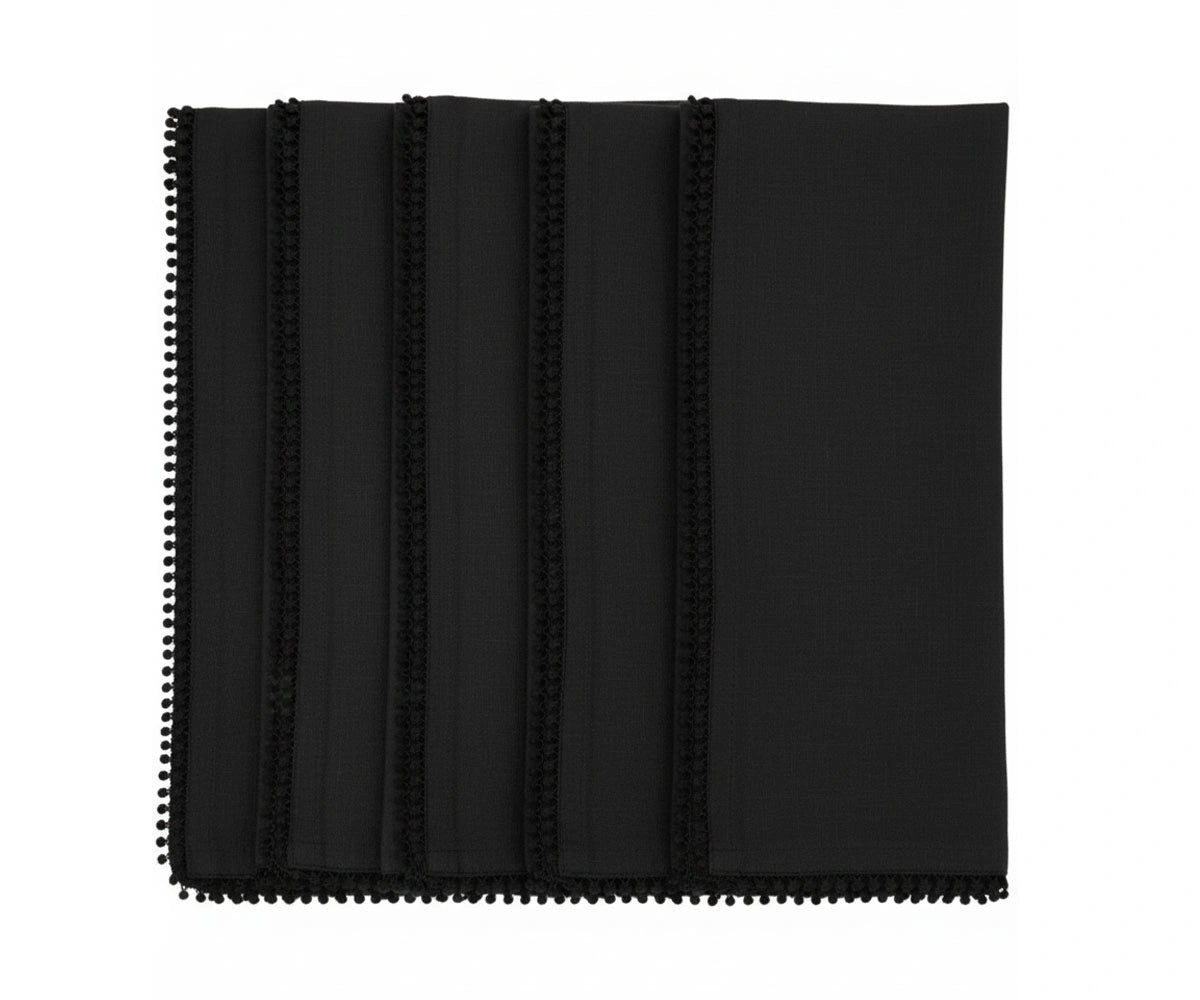 Black cotton pom pom napkins with knotted edge trim for modern and elegant table décor