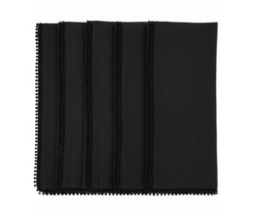 Black cotton pom pom napkins with knotted edge trim for modern and elegant table décor