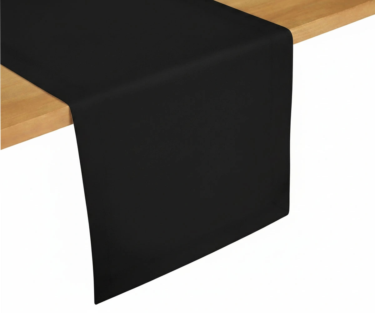 Black cotton table runner placed on dining table, modern bold table décor accent with clean minimal finish