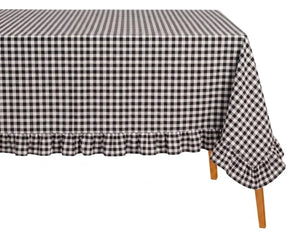 Rectangular cotton gingham tablecloth with soft ruffle edge styled on a dining table for everyday farmhouse decor