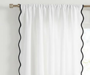 White scalloped curtain panel with black trim