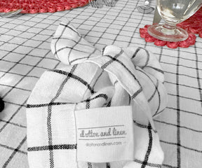 White linen napkins neatly folded and arranged for an upscale dining experience..