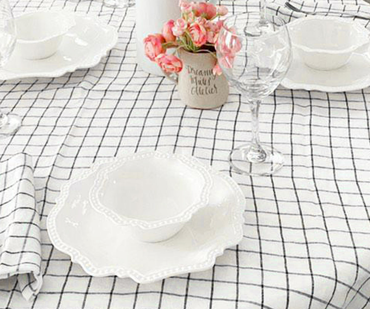 Discover black and white stripe tablecloths in a range of sizes, including round, to elevate your table decor.