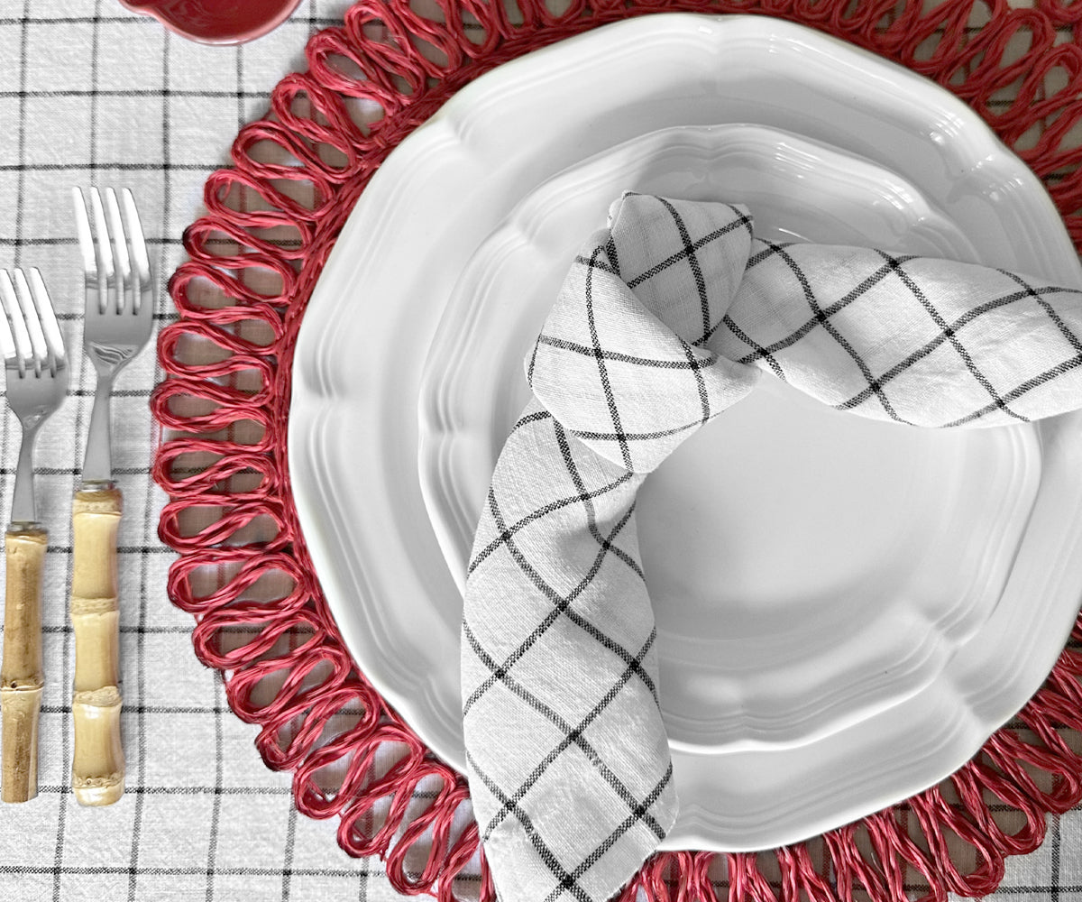 White linen napkins, adding a classic and sophisticated touch to any table setting.