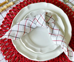 Red and black linen napkins with a stylish grid pattern, perfect for elegant dining.
