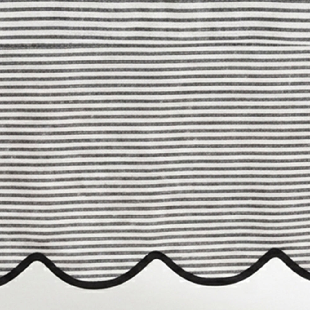 Black striped linen tablecloth material featuring a detailed scallop hem design for modern kitchen and dining decor.