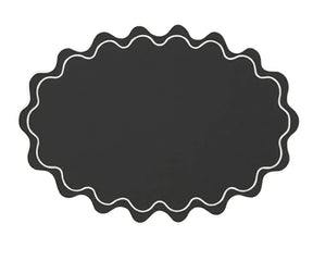 Wavy oval cotton placemat with elegant scalloped edge, designed for refined everyday and event dining tables
