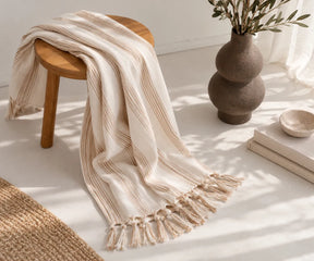 Beige and white striped cotton throw blanket for cozy fall and autumn home décor